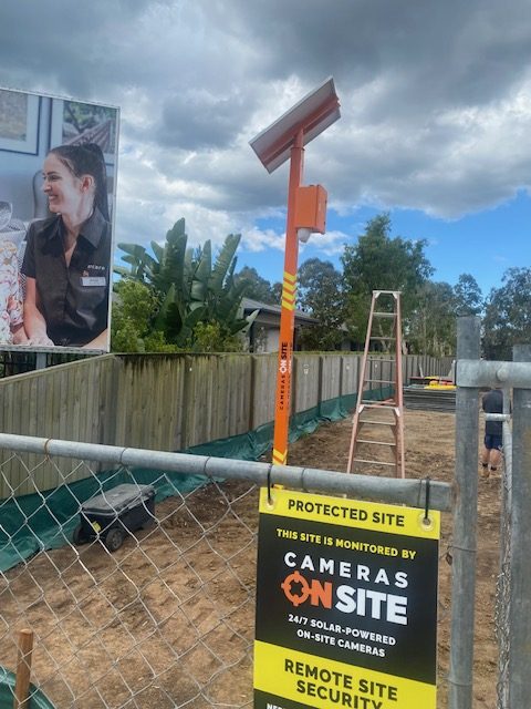 Construction site with Cameras On Site solar powered security camera tower providing 24/7 remote monitoring and protection Australia